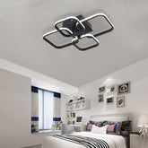 Modern bedroom with a stylish ceiling light fixture.